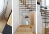 The Stylish Staircase Made of Metal Framework and Wooden Panels
