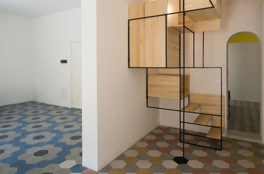 The Stylish Staircase Made of Metal Framework and Wooden Panels