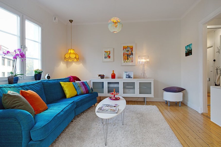 Apartment With Light And Colourful Interior - bright turquoise sofa