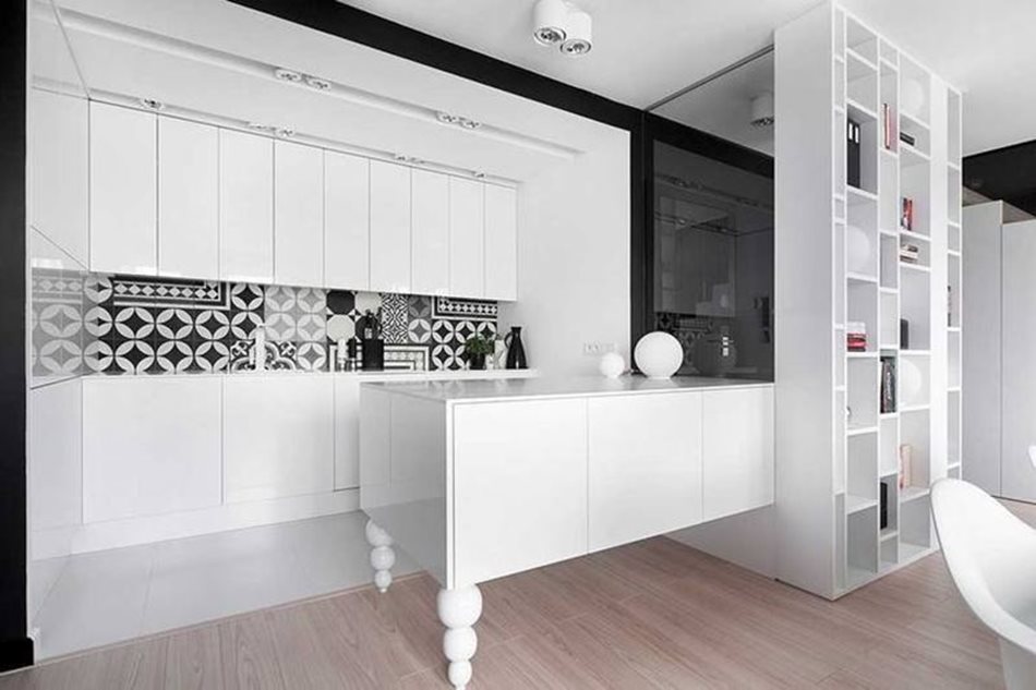 Apartment interior design in black and white colors - Glossy snow-white cupboards and tabletops are used as kitchen furniture