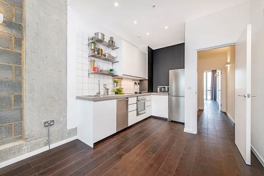 Industrial style London apartment - kitchen and hallway to the bedroom