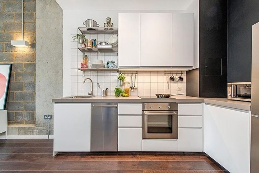 Industrial style London apartment - kitchen and raw concrete wall