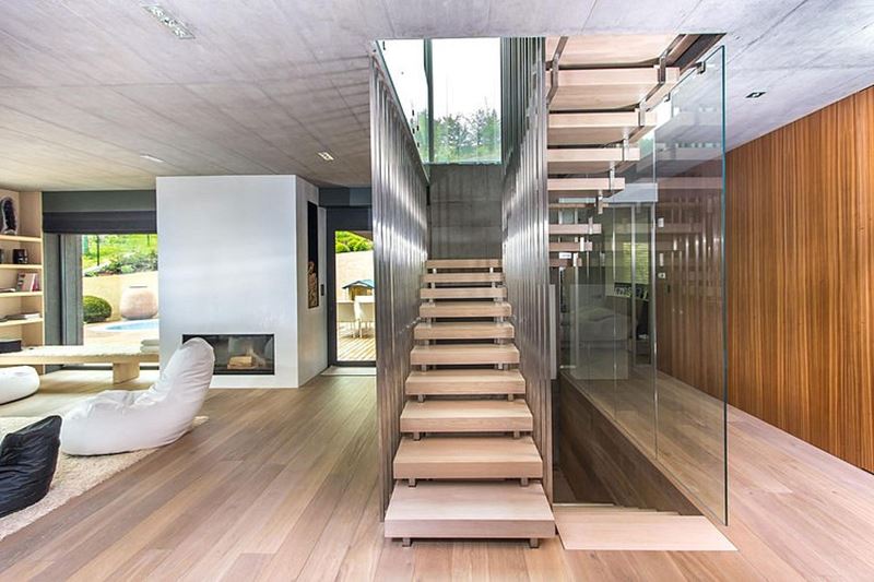 This modern three-story house - living room and staircase