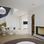Elegant interior design: a duplex apartment with a fireplace in the QUANT complex