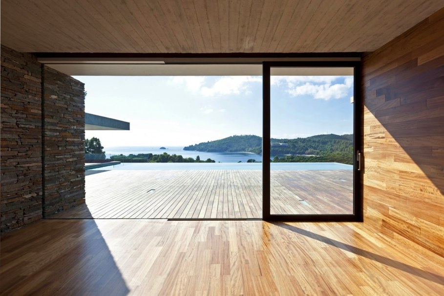 The shining Plane House residence on the Greek island - large glass doors
