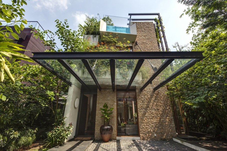 Tan's Garden Villa in Singapore - stone flooring with glass canopy