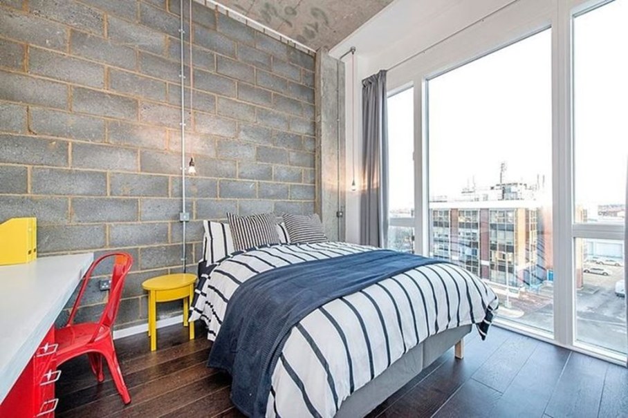 Industrial style London apartment - bedroom with large windows