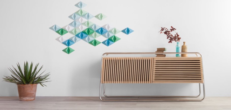 Marcel is a smart sideboard made of wood and tubular metal