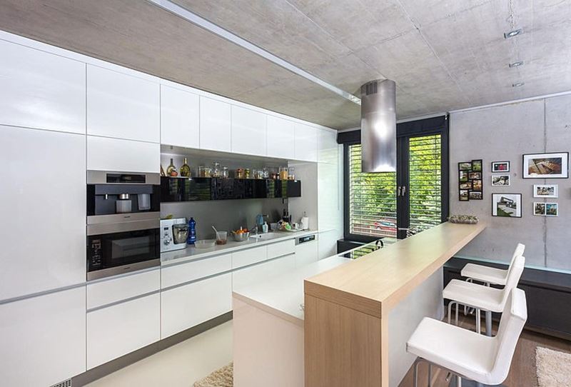 This modern three-story house - White cupboards in the kitchen